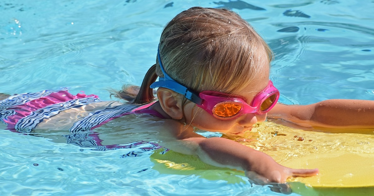 A stack of pool rafts and floats on a sunny day